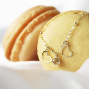 Złota bransoletka z sercami i kamieniem 333